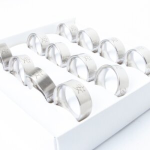 Stainless steel ring box with 12 pieces with Asian characters, size mixed