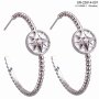 Hoops earrings with star shaped pendants, plated with real rhodium