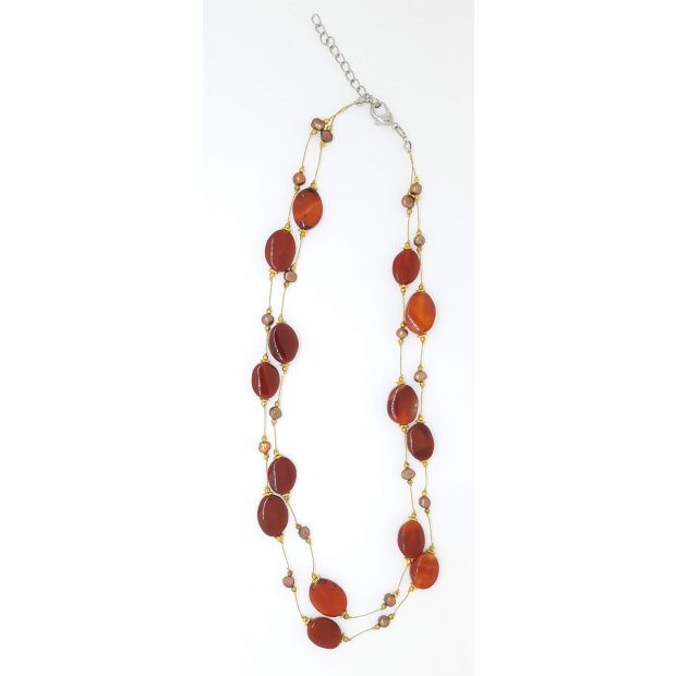 Golden necklace with red gemstones